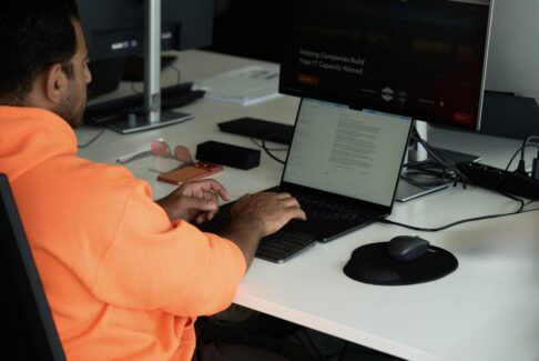 Developer at a workstation, developer salary Poland vs USA benchmarks
